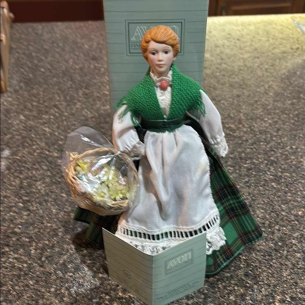 Green and White Porcelain Doll with Basket Avon 1990